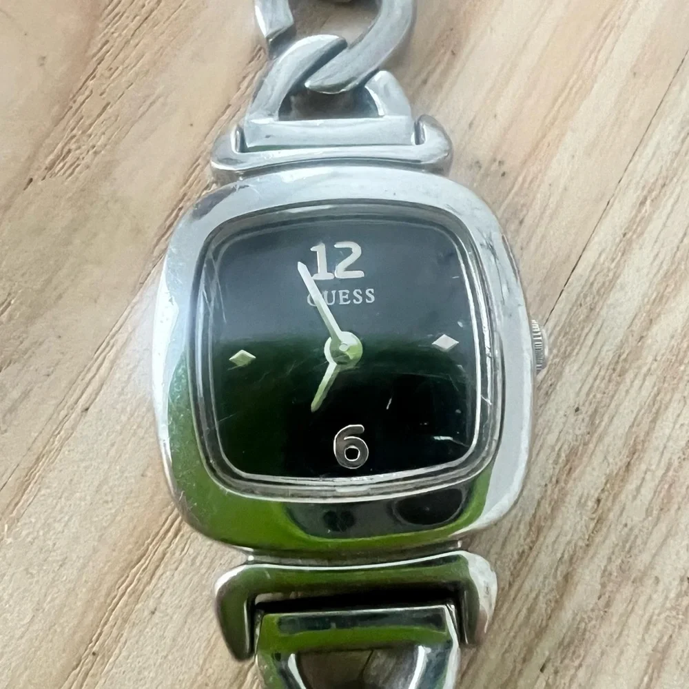 Guess ladies rectangular black dial silver tone  bracelet watch NEW BATTERY